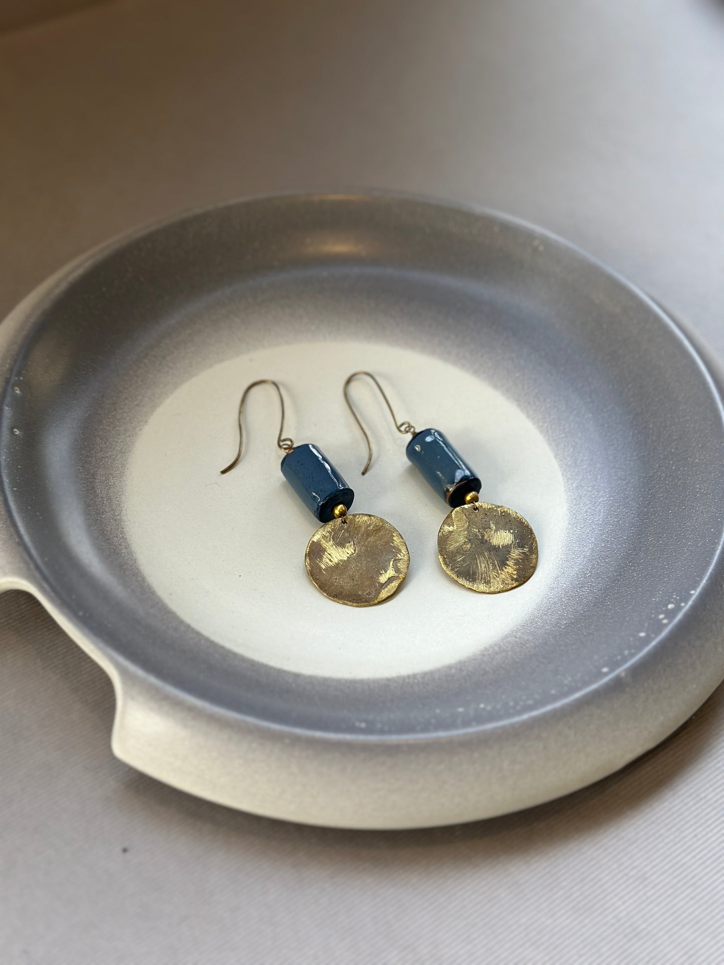 brass cera earrings