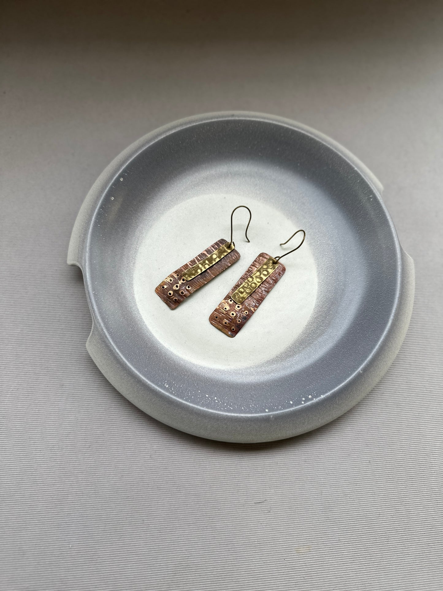 flat patina dual tone earrings