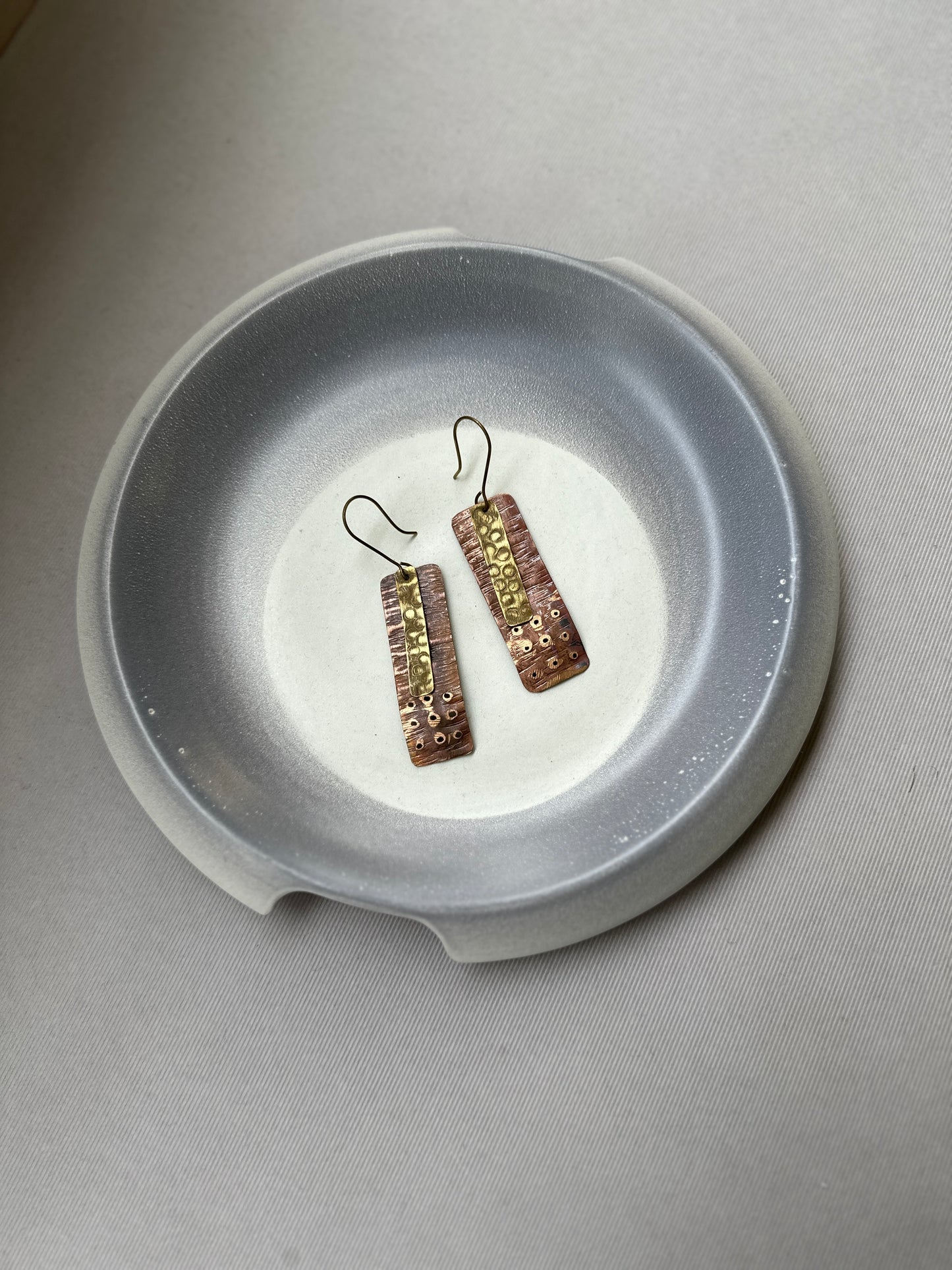 flat patina dual tone earrings